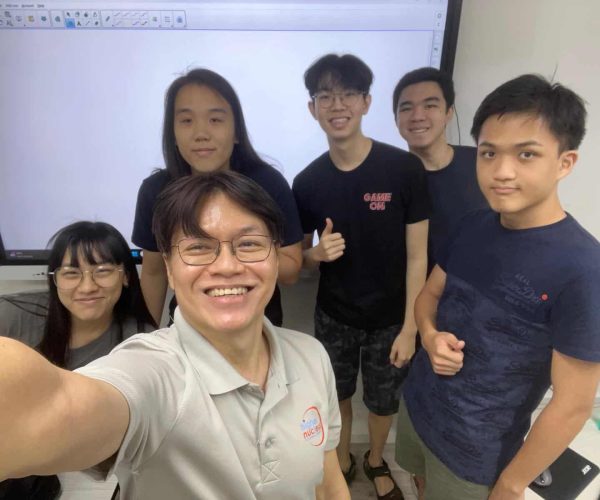 Mr Nicholas Lim and his students