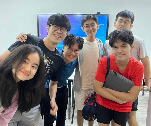 Mr Nicholas Lim and his students